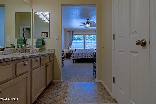 bathroom featuring vanity, ceiling fan, and tile patterned floors