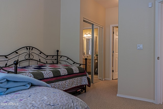 carpeted bedroom featuring a closet