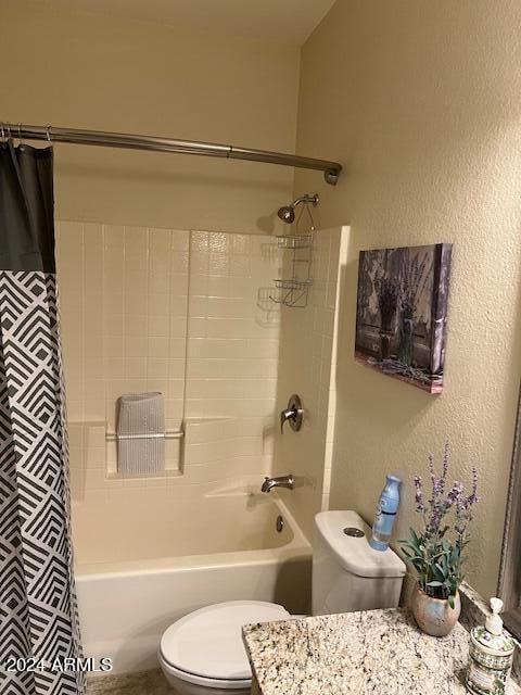 full bathroom featuring vanity, toilet, and shower / bath combination with curtain