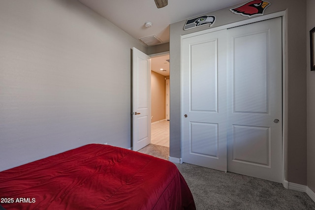 carpeted bedroom featuring a closet