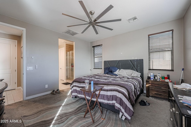 bedroom featuring connected bathroom, light carpet, and ceiling fan