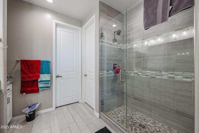 bathroom with a shower with shower door