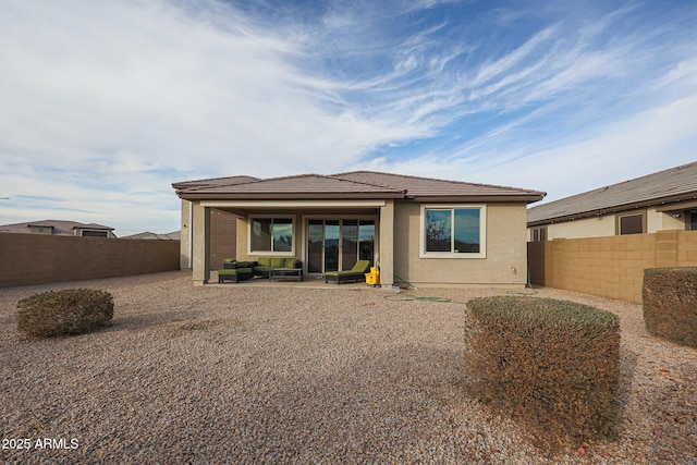 rear view of property with a patio area