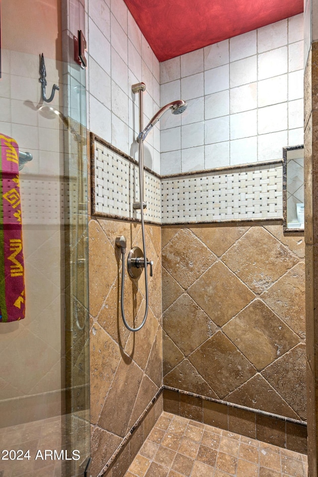 bathroom with tiled shower