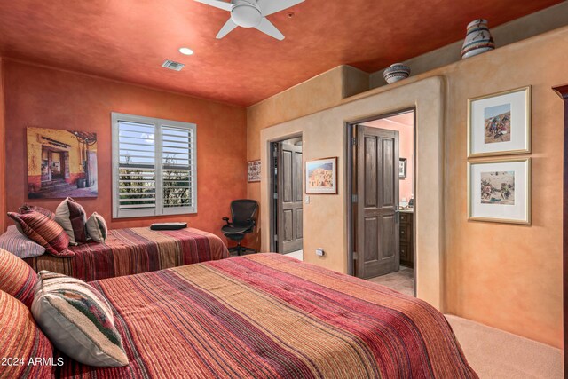 bedroom featuring light carpet and ceiling fan