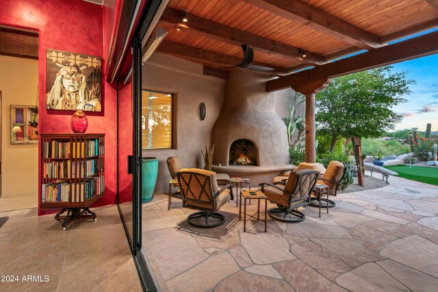 view of patio / terrace featuring an outdoor fireplace