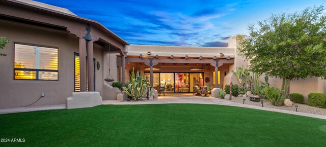 exterior space with a pergola, a yard, and a patio