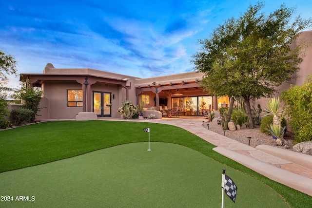 back of house featuring a yard and a patio area