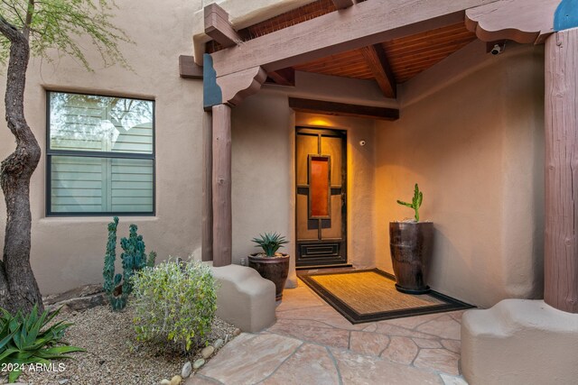 entrance to property with a patio