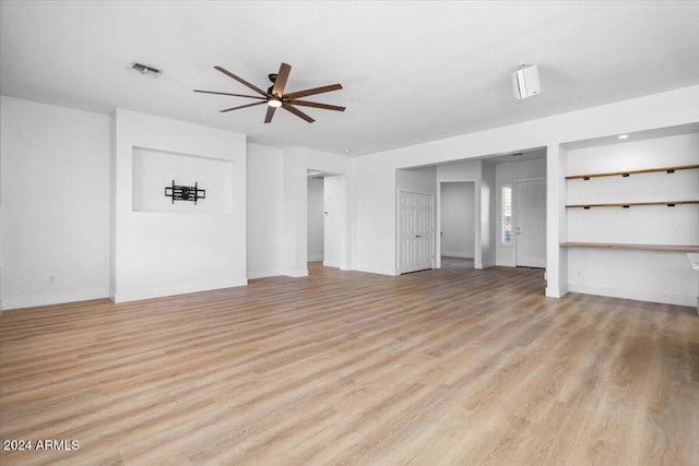 unfurnished living room featuring light hardwood / wood-style flooring and ceiling fan