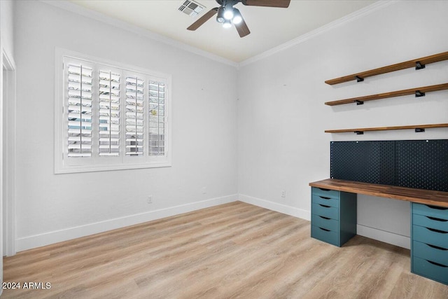 unfurnished office with crown molding, ceiling fan, and light wood-type flooring