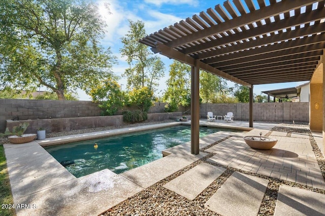 view of pool with a pergola and a patio area