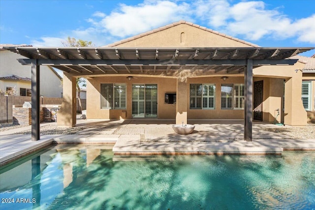 rear view of property featuring a patio