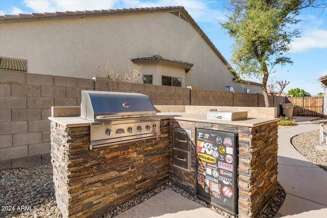 view of patio / terrace featuring grilling area and exterior kitchen