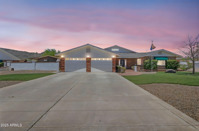 4304 W Calle Poco, Laveen, AZ 85339 - ranch-style home with concrete driveway and an attached garage