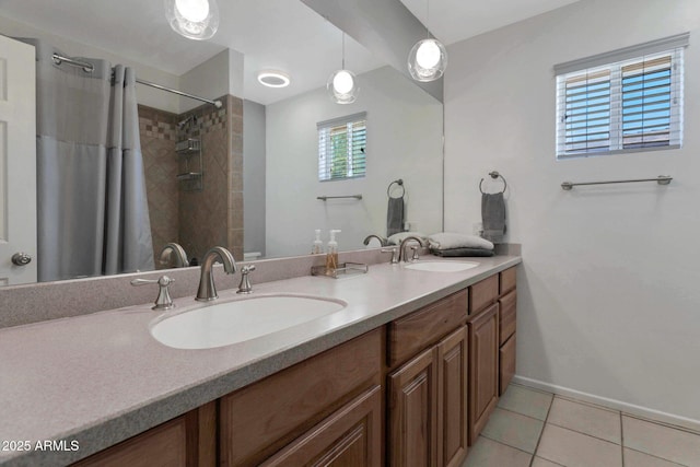 4304 W Calle Poco, Laveen, AZ 85339 - full bath featuring double vanity, tile patterned floors, plenty of natural light, and a shower with curtain