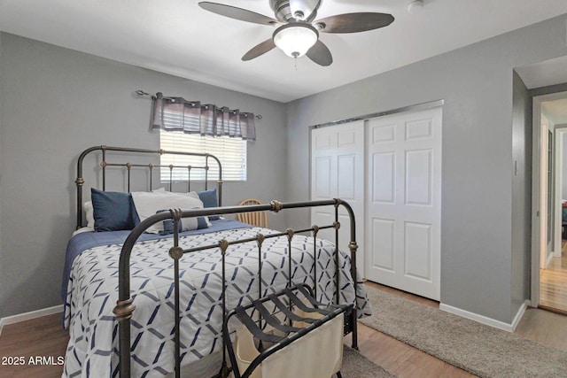 4304 W Calle Poco, Laveen, AZ 85339 - bedroom featuring baseboards, wood finished floors, and a closet