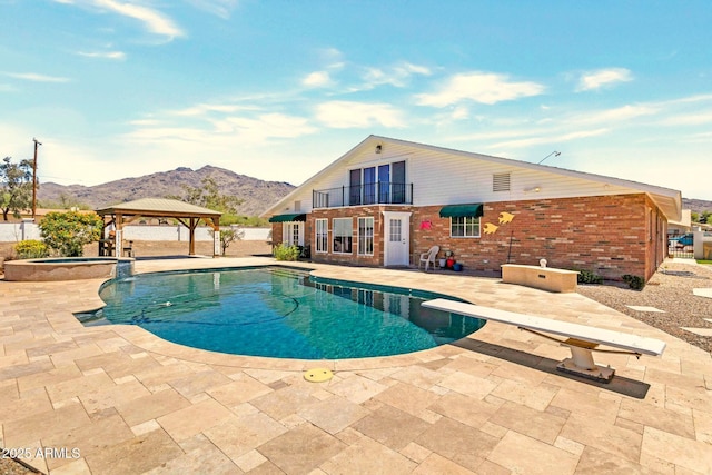 4304 W Calle Poco, Laveen, AZ 85339 - view of pool featuring a gazebo, a patio area, a mountain view, a pool with connected hot tub, and a diving board