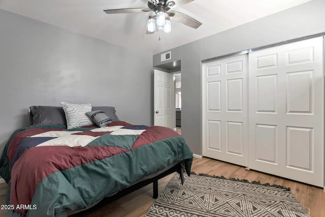 4304 W Calle Poco, Laveen, AZ 85339 - bedroom featuring wood finished floors, ceiling fan, and a closet