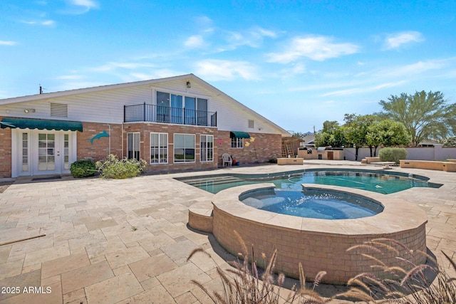 4304 W Calle Poco, Laveen, AZ 85339 - view of pool featuring a patio area, french doors, and a pool with connected hot tub