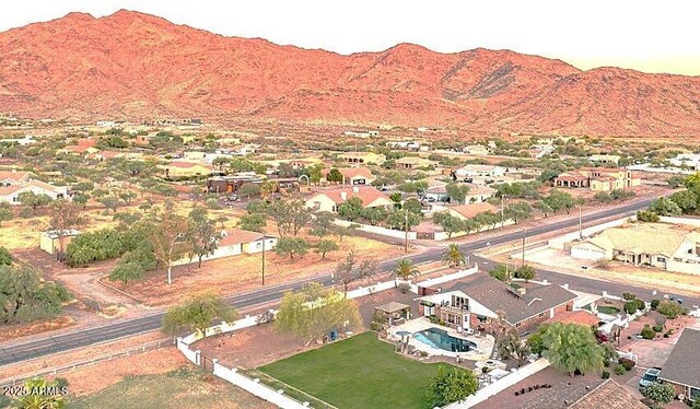 4304 W Calle Poco, Laveen, AZ 85339 - aerial view of property's location featuring a mountainous background and nearby suburban area
