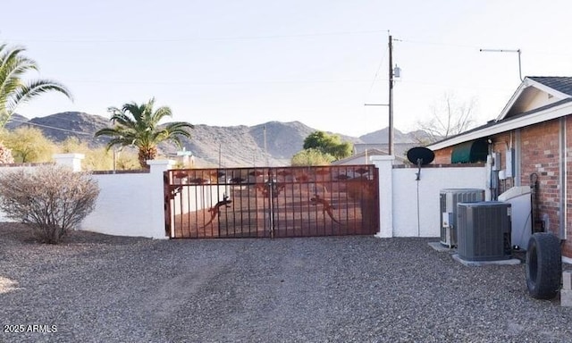 4304 W Calle Poco, Laveen, AZ 85339 - gate featuring a mountain view and cooling unit