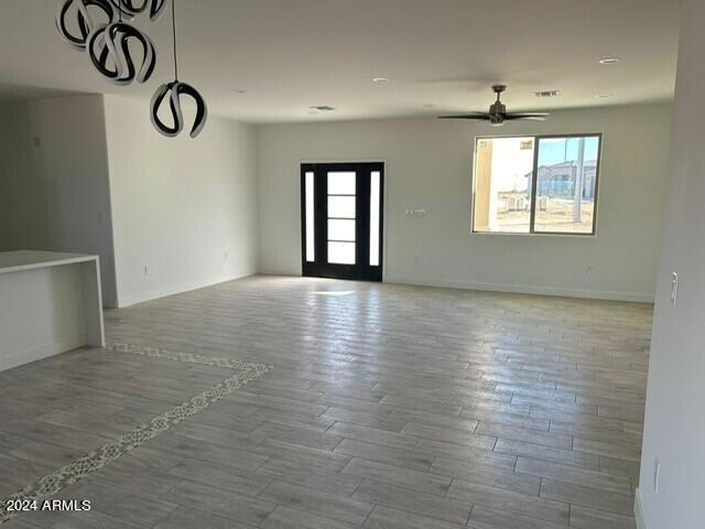 spare room featuring ceiling fan and wood-type flooring