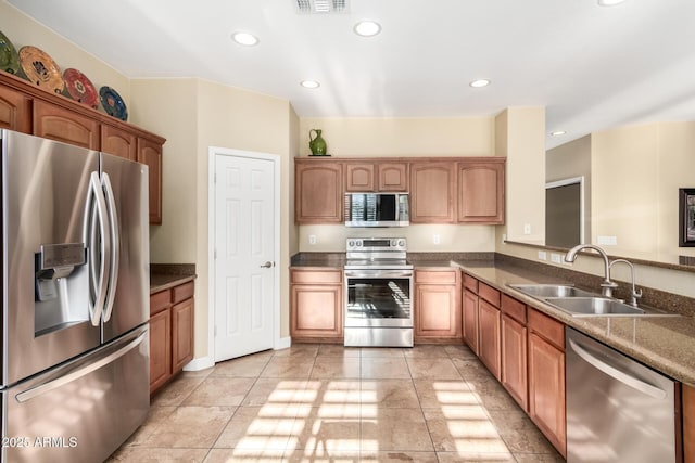 kitchen featuring recessed lighting, a sink, visible vents, and stainless steel appliances