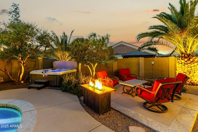 view of patio / terrace with a fenced backyard and a fire pit