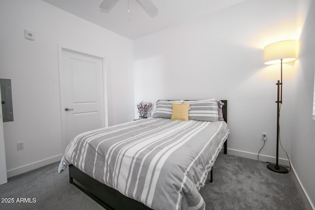 bedroom featuring ceiling fan, electric panel, and dark carpet