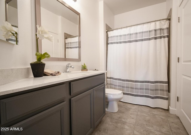 bathroom with toilet, vanity, and walk in shower