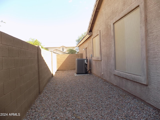 view of yard featuring central AC and a fenced backyard