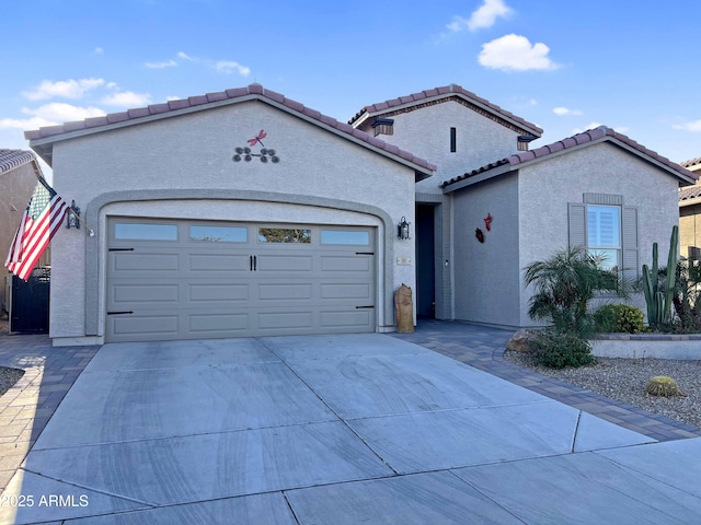 mediterranean / spanish-style home featuring a garage