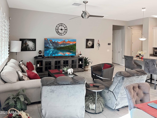 living room with light tile patterned flooring and ceiling fan