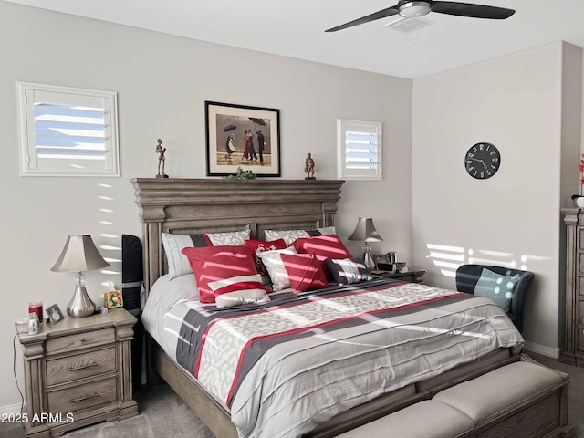 bedroom featuring ceiling fan and carpet