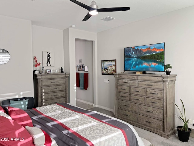 bedroom with light carpet and ceiling fan