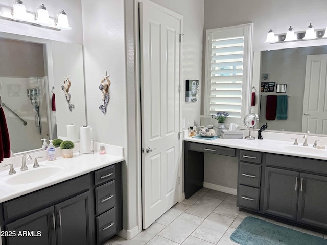 bathroom featuring vanity, tile patterned floors, and a shower with shower door