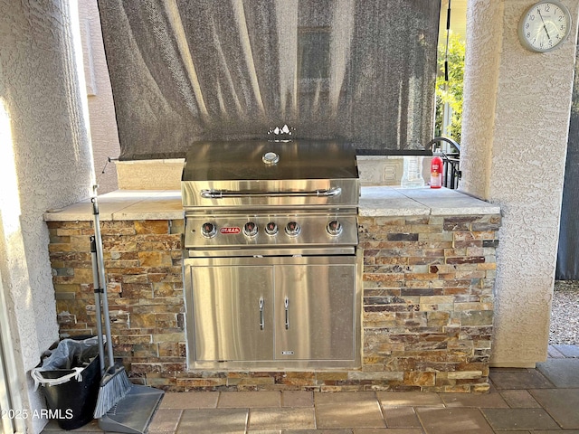 view of patio featuring area for grilling and an outdoor kitchen