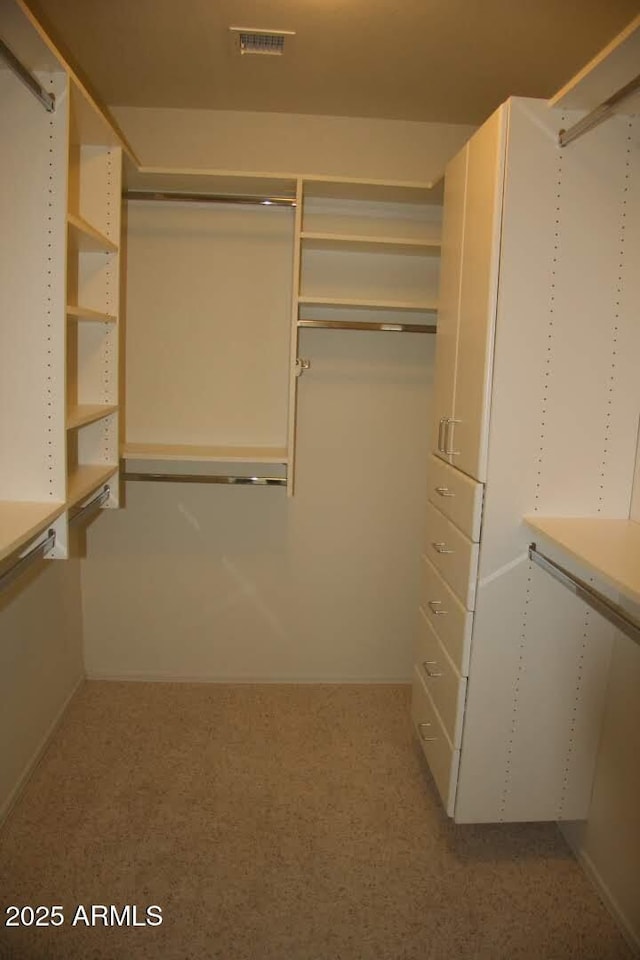 walk in closet with visible vents