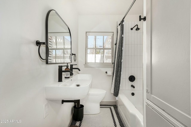 bathroom featuring tile patterned flooring, toilet, and shower / tub combo with curtain