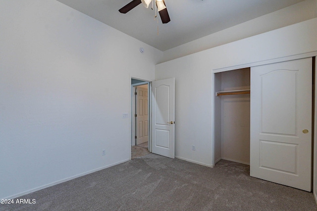 unfurnished bedroom featuring ceiling fan, a closet, baseboards, and carpet floors