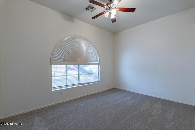 carpeted empty room with ceiling fan