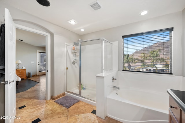 bathroom with vanity and plus walk in shower