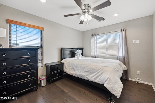 bedroom featuring ceiling fan and dark hardwood / wood-style floors