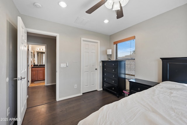 bedroom with ceiling fan and dark hardwood / wood-style flooring