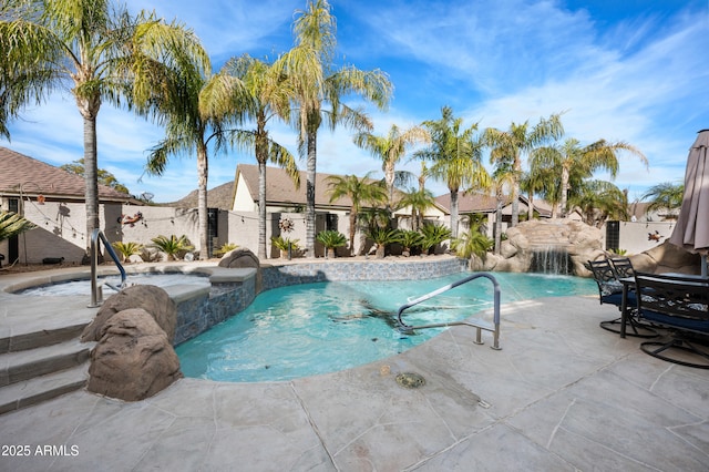 view of pool with a patio area and pool water feature