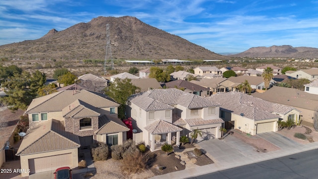 birds eye view of property featuring a mountain view