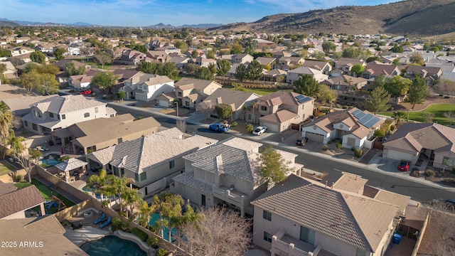 birds eye view of property with a mountain view