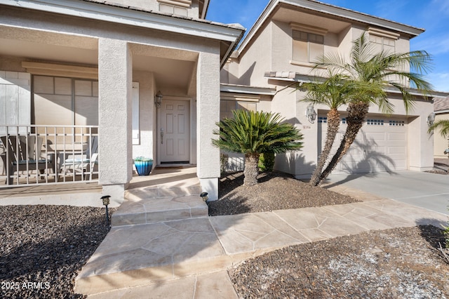 doorway to property with a garage