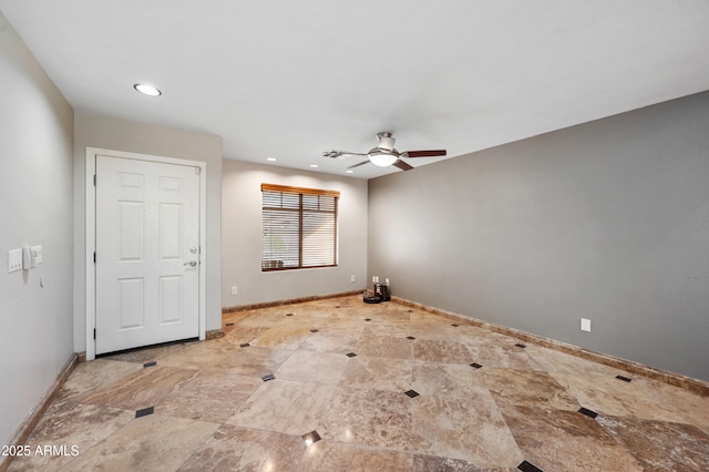 unfurnished room with ceiling fan